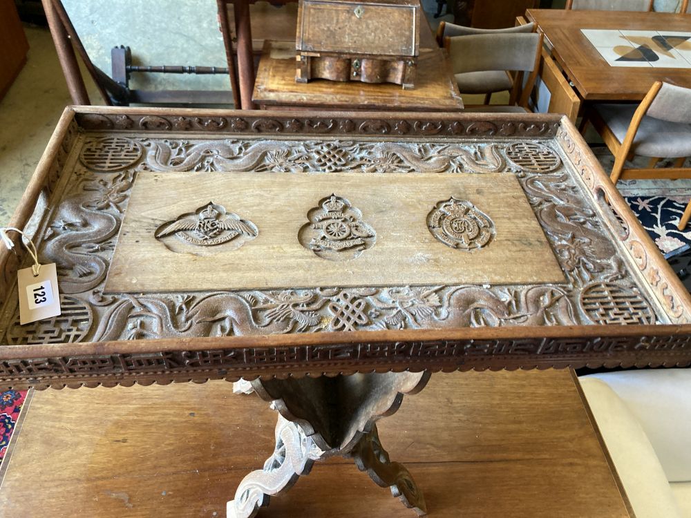 A WWI Sino-Burmese carved teak tray on folding stand,